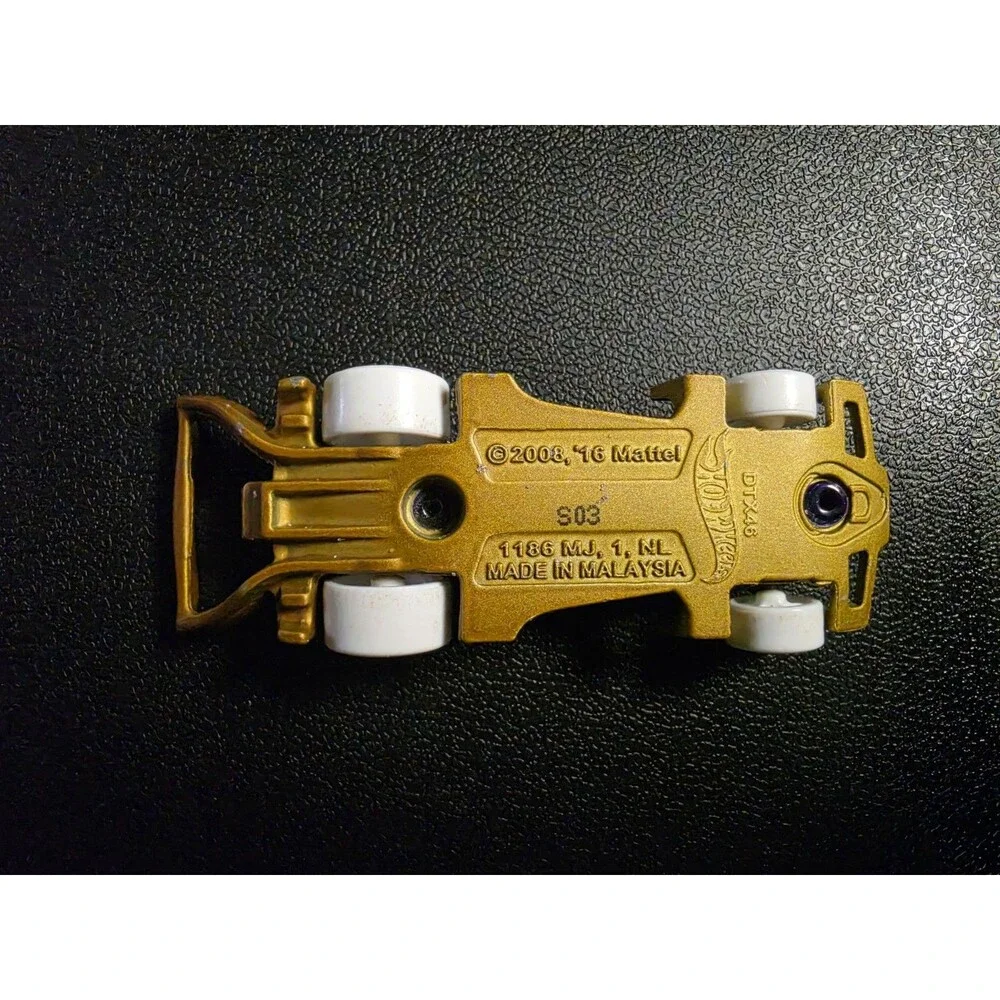 Lot of 4 loose Hot Wheels vehicles in pre-owned condition.